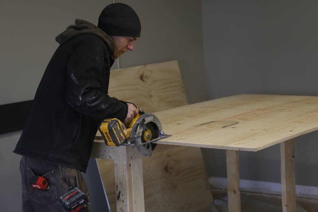 Cutting a sheet of plywood with a circular saw